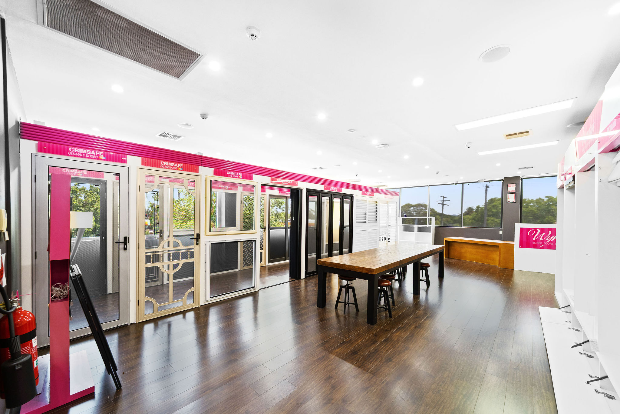 Ground floor showroom with timber-look floors and high ceilings